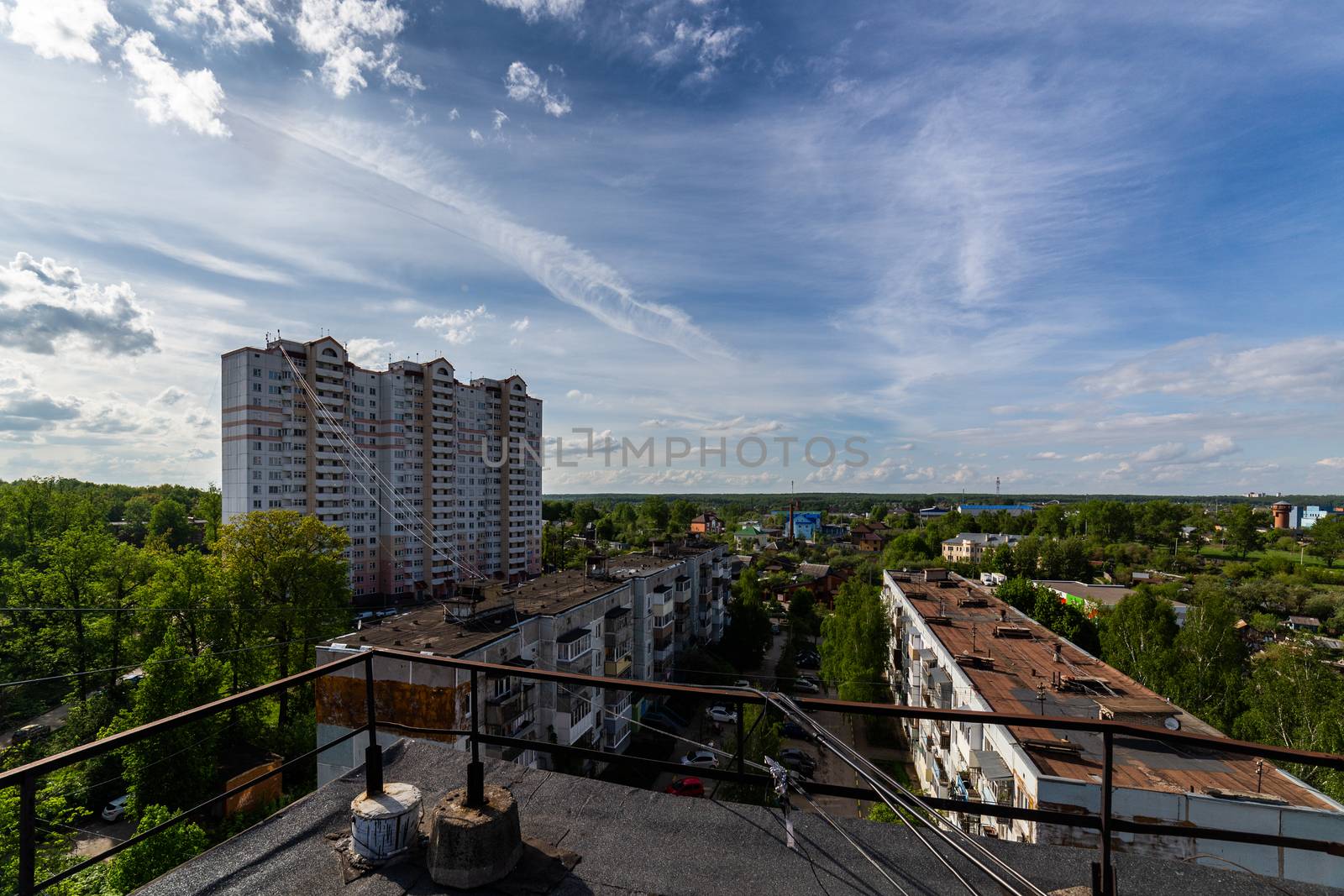 summer day view on russian suburb condominium houses from roof.