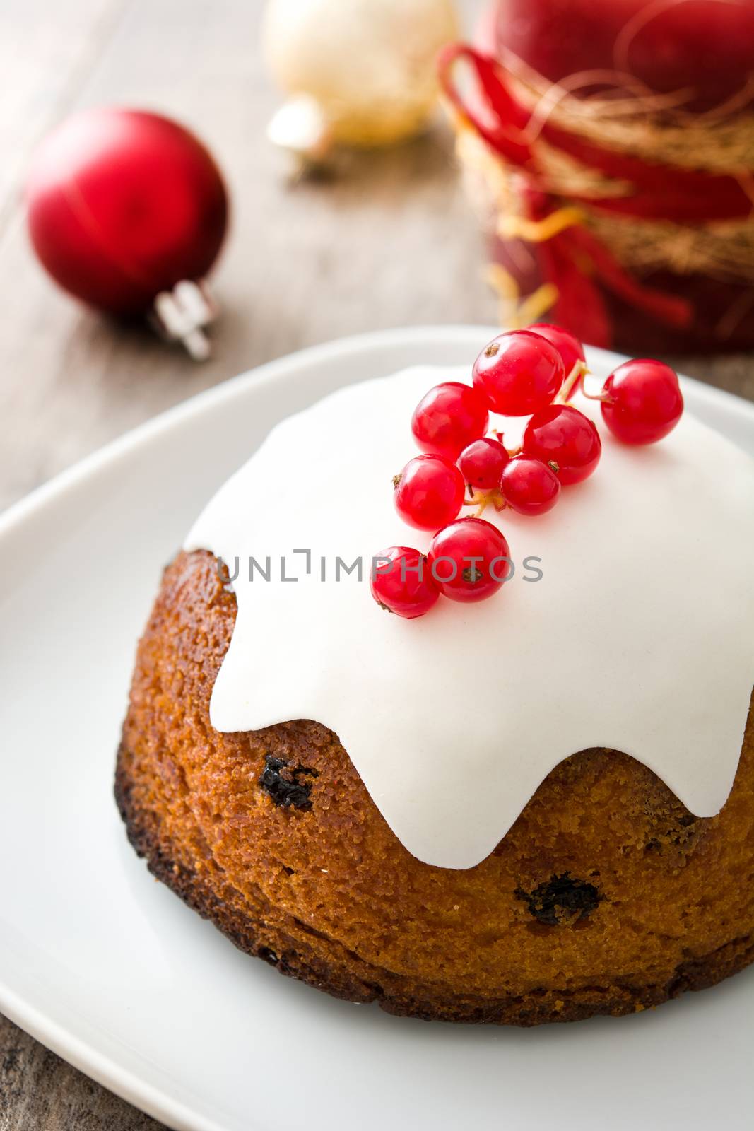 Christmas pudding on wooden table by chandlervid85