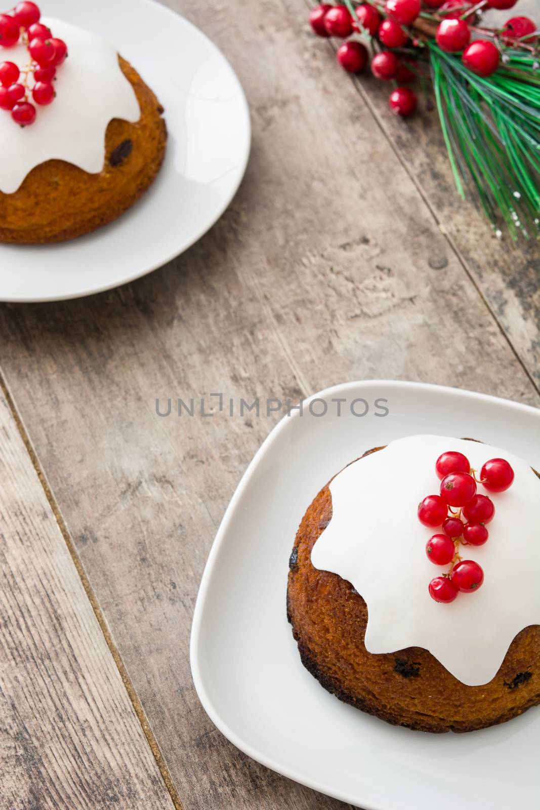 Christmas pudding on wooden table by chandlervid85