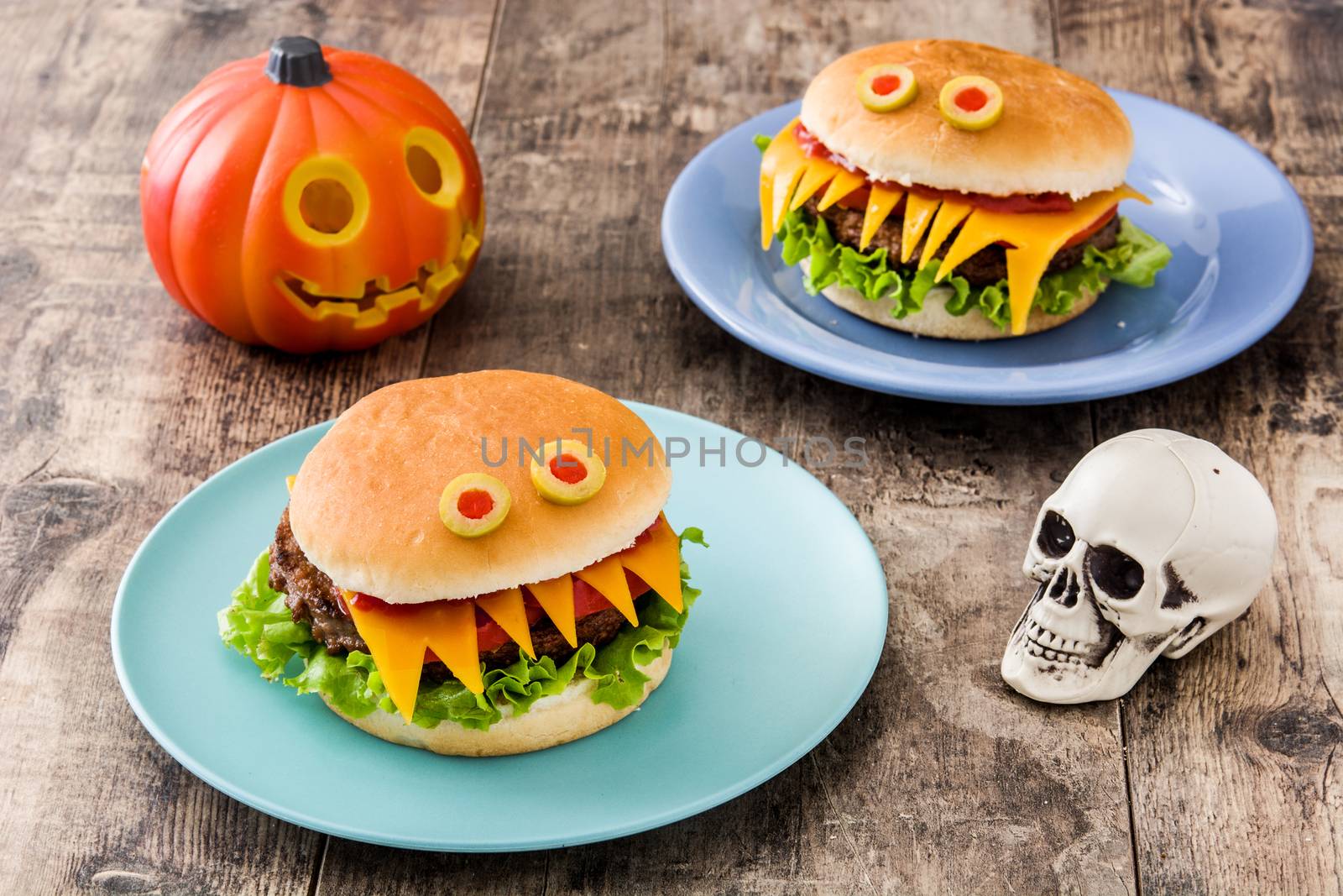 Halloween burger monsters on wooden table by chandlervid85