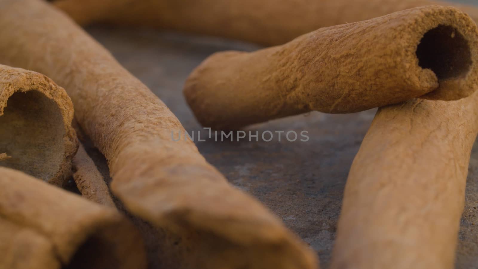 Macro shot of dried cinnamon bark - famous aromatic spice. Extreme close up