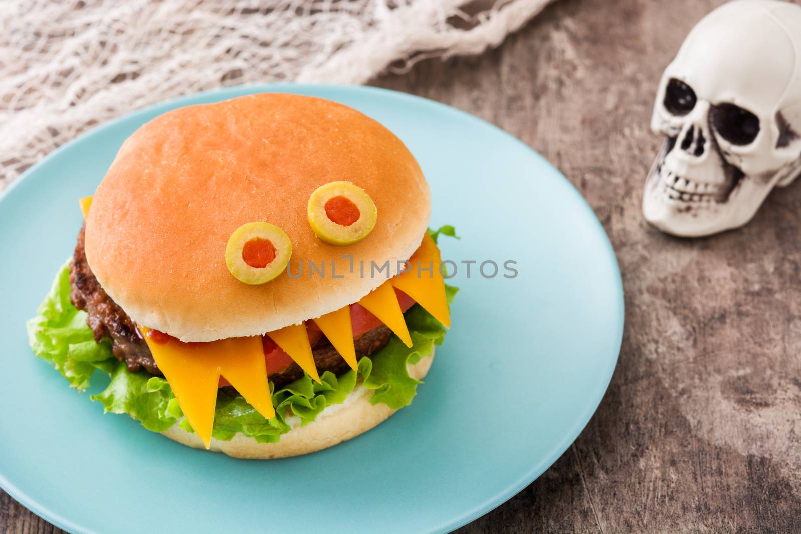 Halloween burger monsters on wooden table by chandlervid85