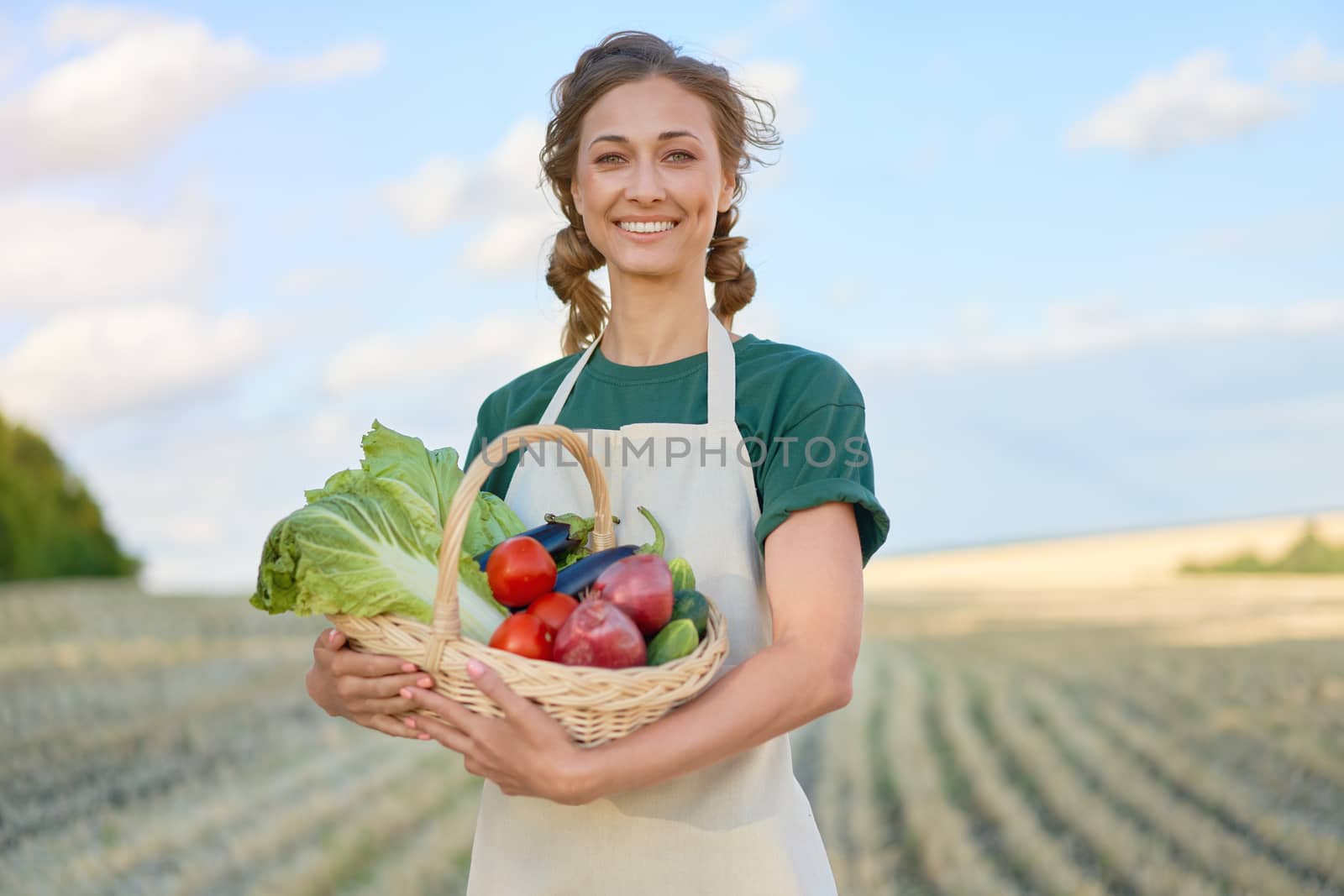 Woman farmer apron standing farmland smiling Female agronomist specialist farming agribusiness Happy positive caucasian worker agricultural field by andreonegin