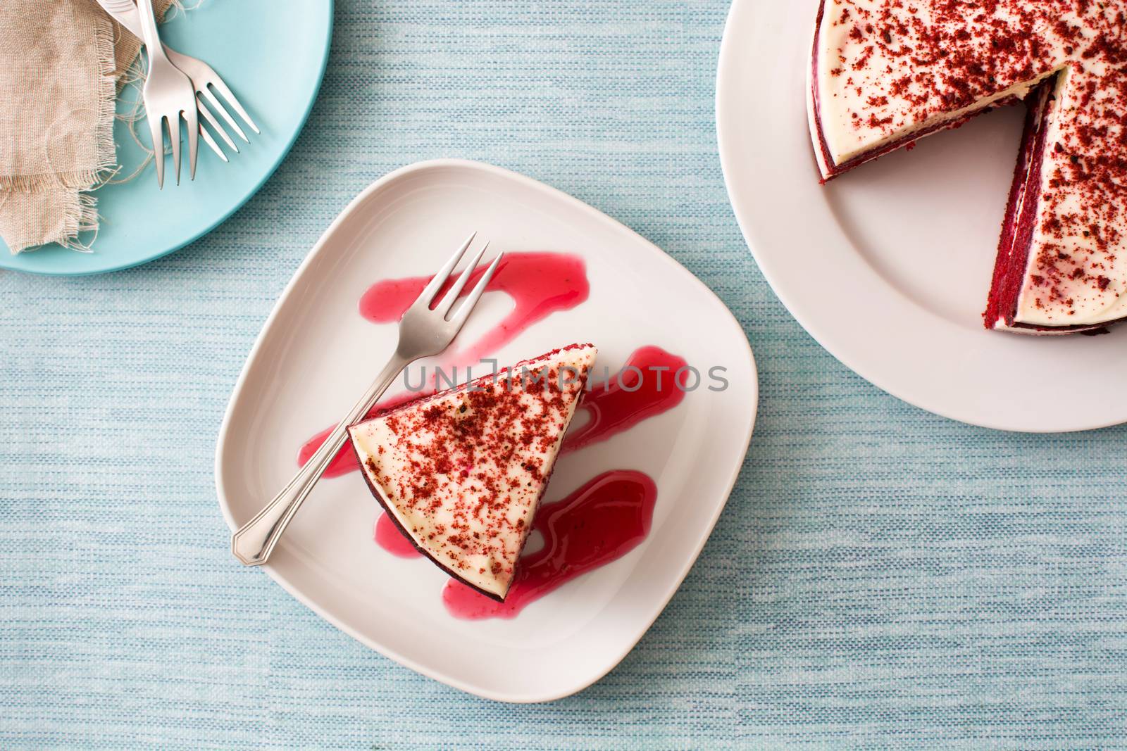 Red Velvet cake slice on blue background