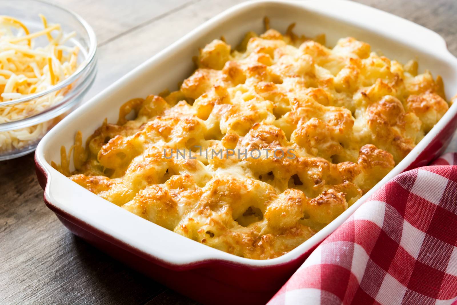 Typical American macaroni and cheese on wooden table