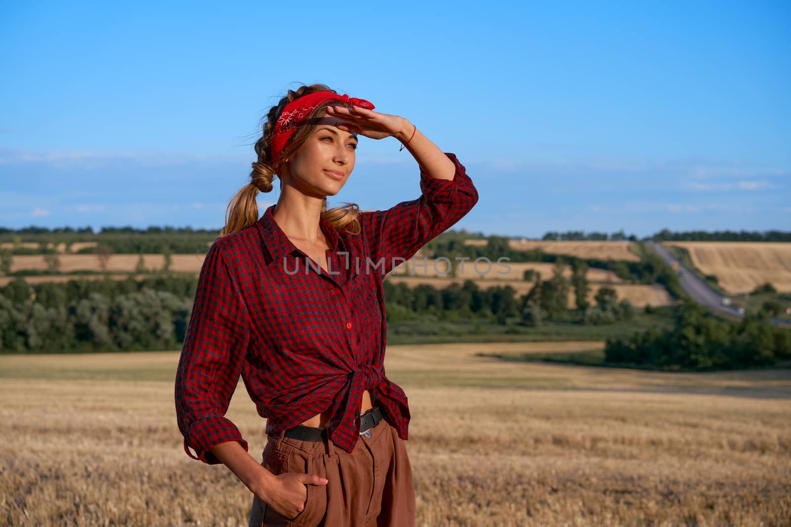 Woman farmer standing farmland smiling Female agronomist specialist farming agribusiness Happy positive caucasian worker agricultural field Pretty girl dressed red checkered shirt and bandana