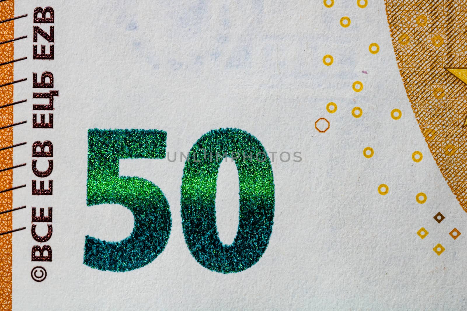 Selective focus on detail of euro banknotes. Close up macro deta by vladispas