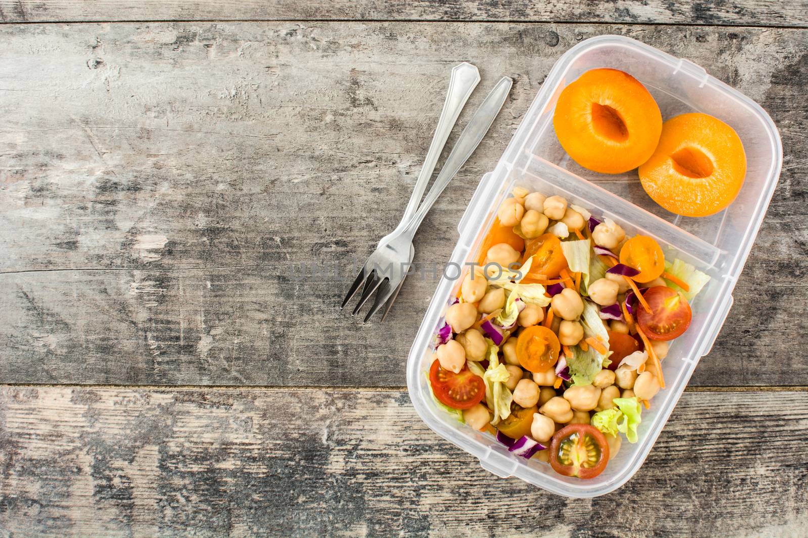 Lunch box with healthy food ready to eat.Chickpea salad on wooden table