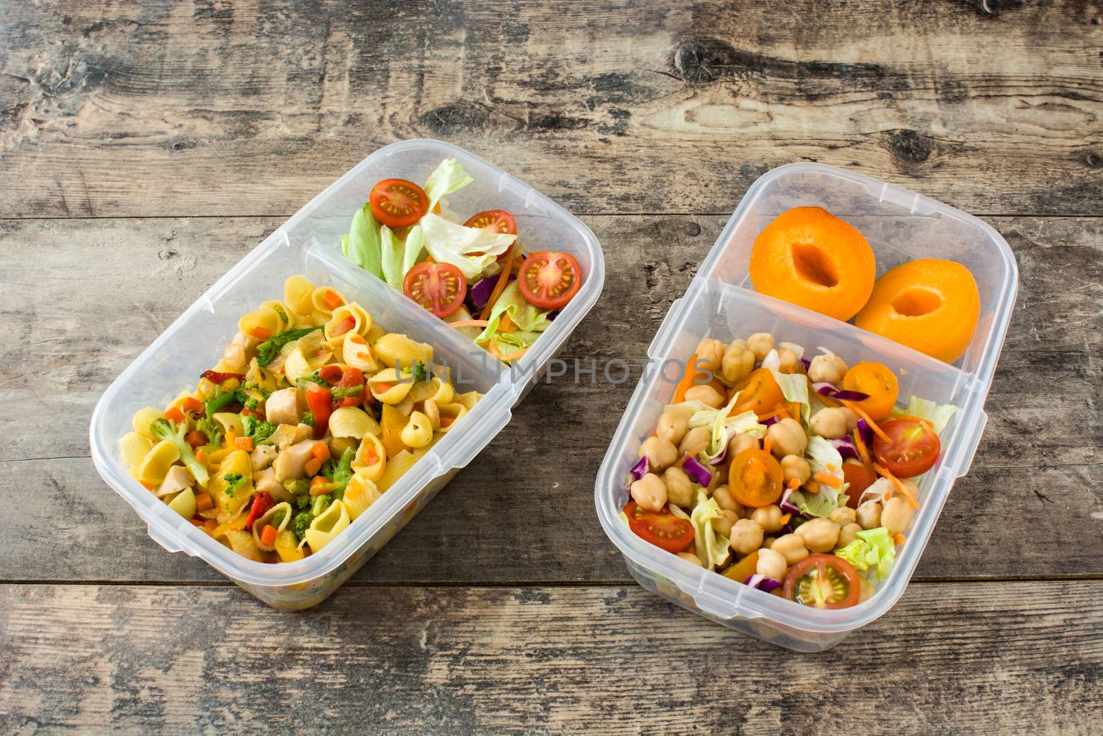 Lunch box with healthy food ready to eat on wooden table