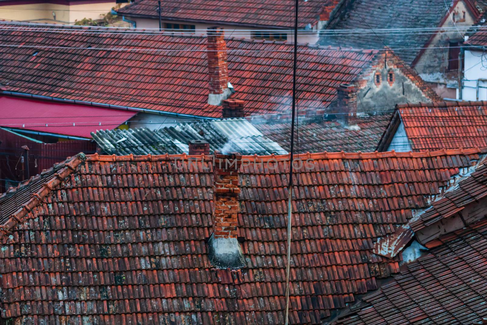 Overview of tile rooftops of old houses. Old buildings architect by vladispas