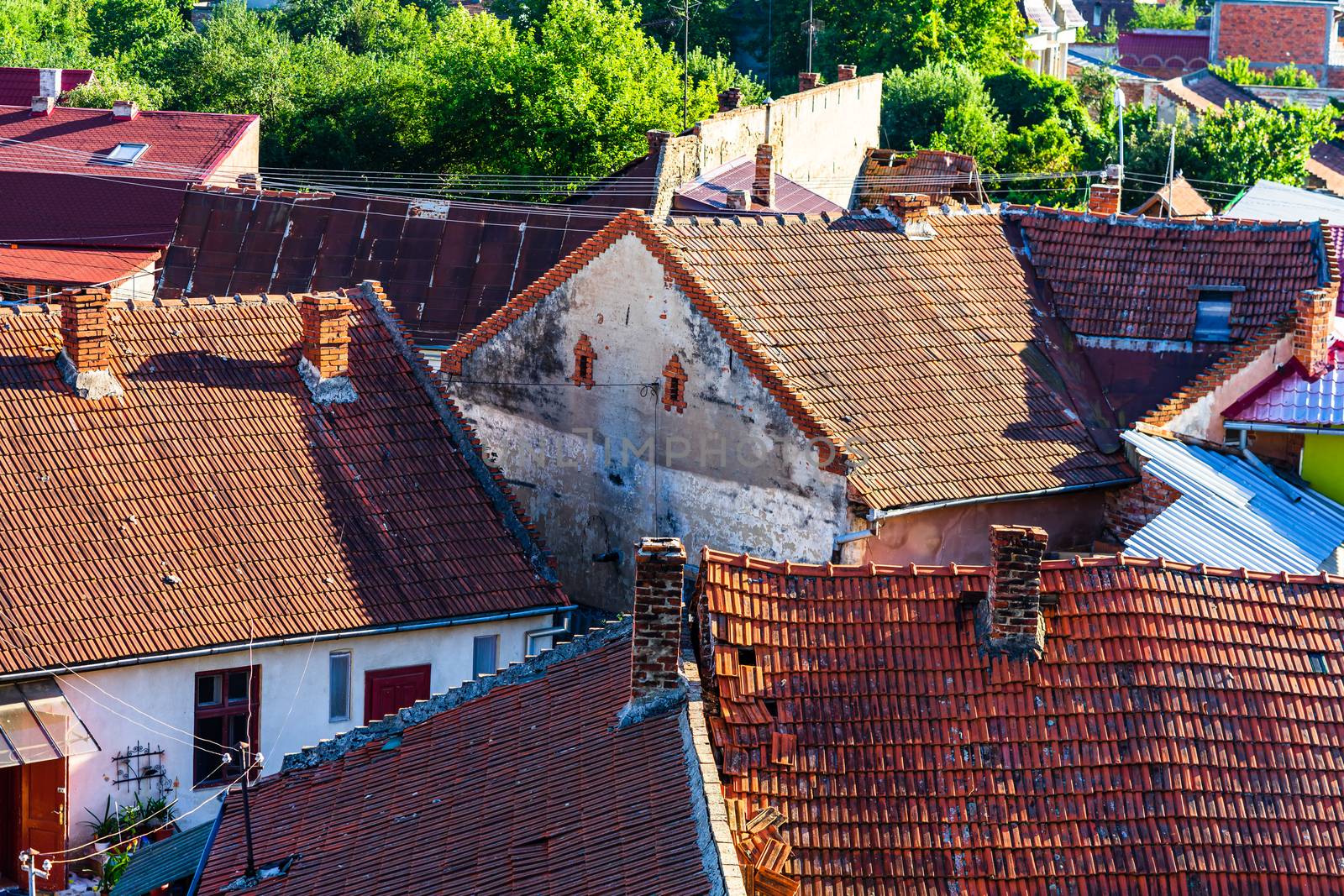 Overview of tile rooftops of old houses. Old buildings architect by vladispas
