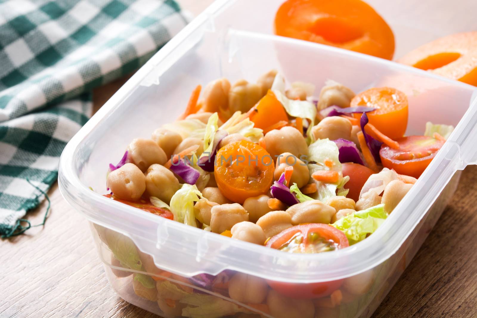 Lunch box with healthy food ready to eat.Chickpea salad on wooden table