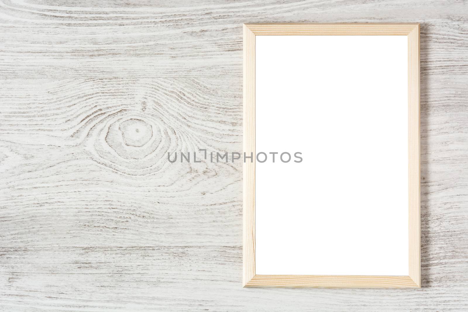 Frame mockup on white wooden table. Top view