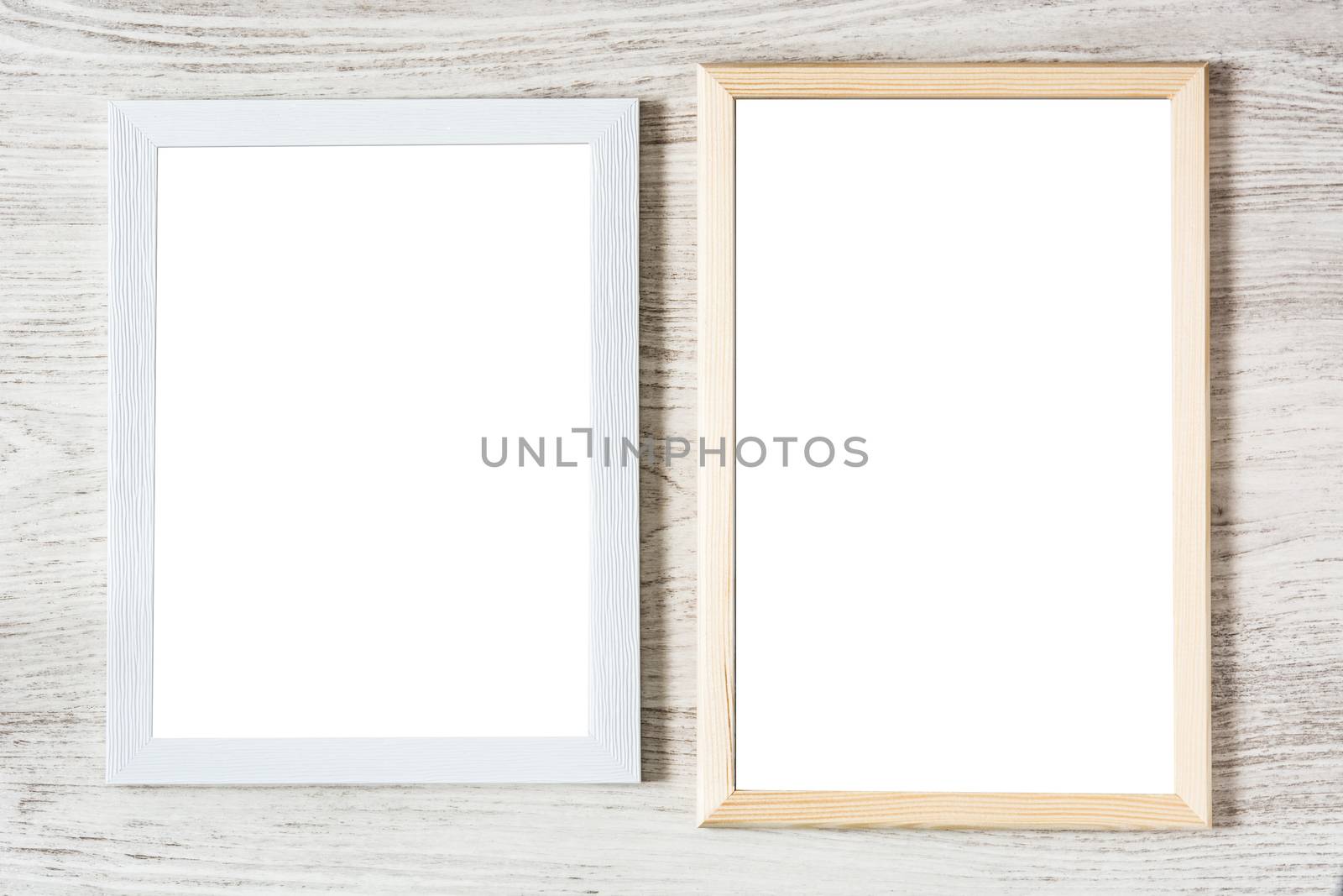 Frame mockup on white wooden table. Top view
