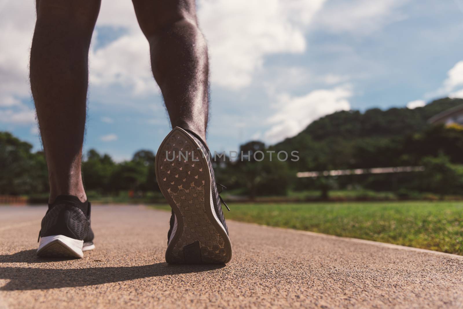 sport runner black man wear feet active ready to running trainin by Sorapop