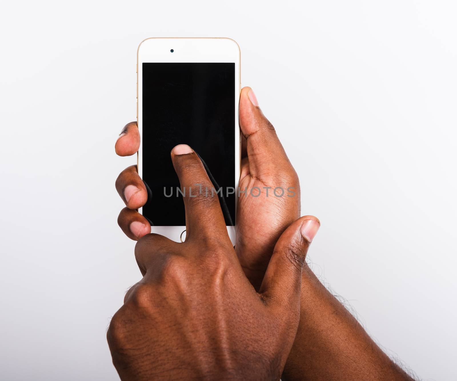Closeup hand black man holding mockup white modern digital mobile smart phone blank screen on hand and point a finger to touch the screen, studio shot isolated on white background