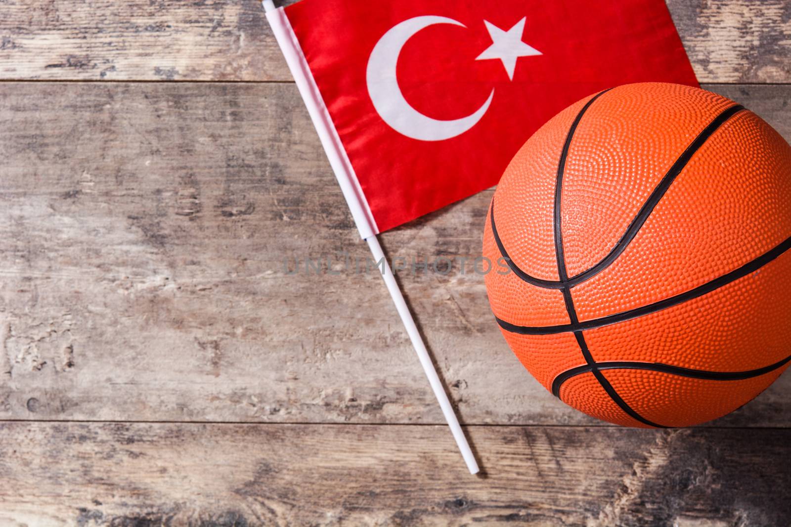 Basketball and Turkey flag on wooden table