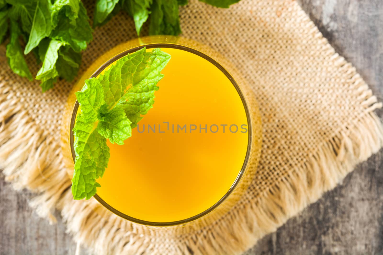 Mango Lassi dessert. Traditional Indian drink on wooden table. Copyspace