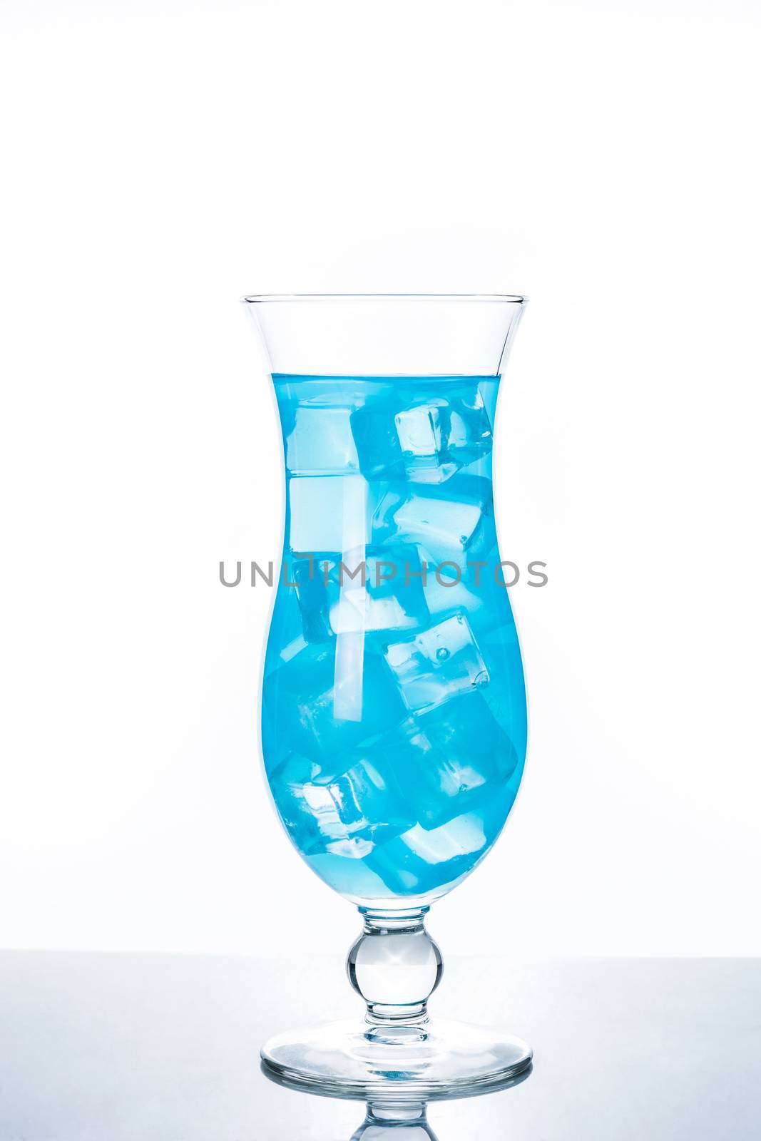 Blue Hawaiian cocktail on white background by chandlervid85