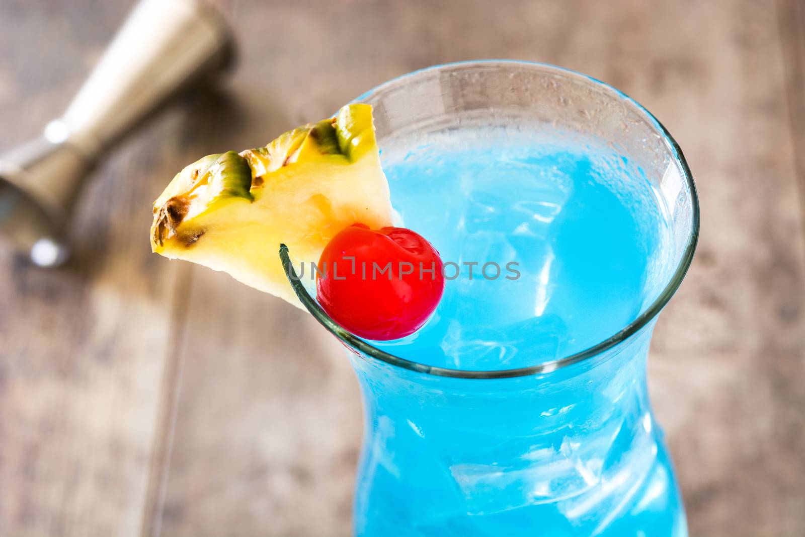 Blue Hawaiian cocktail on wooden table