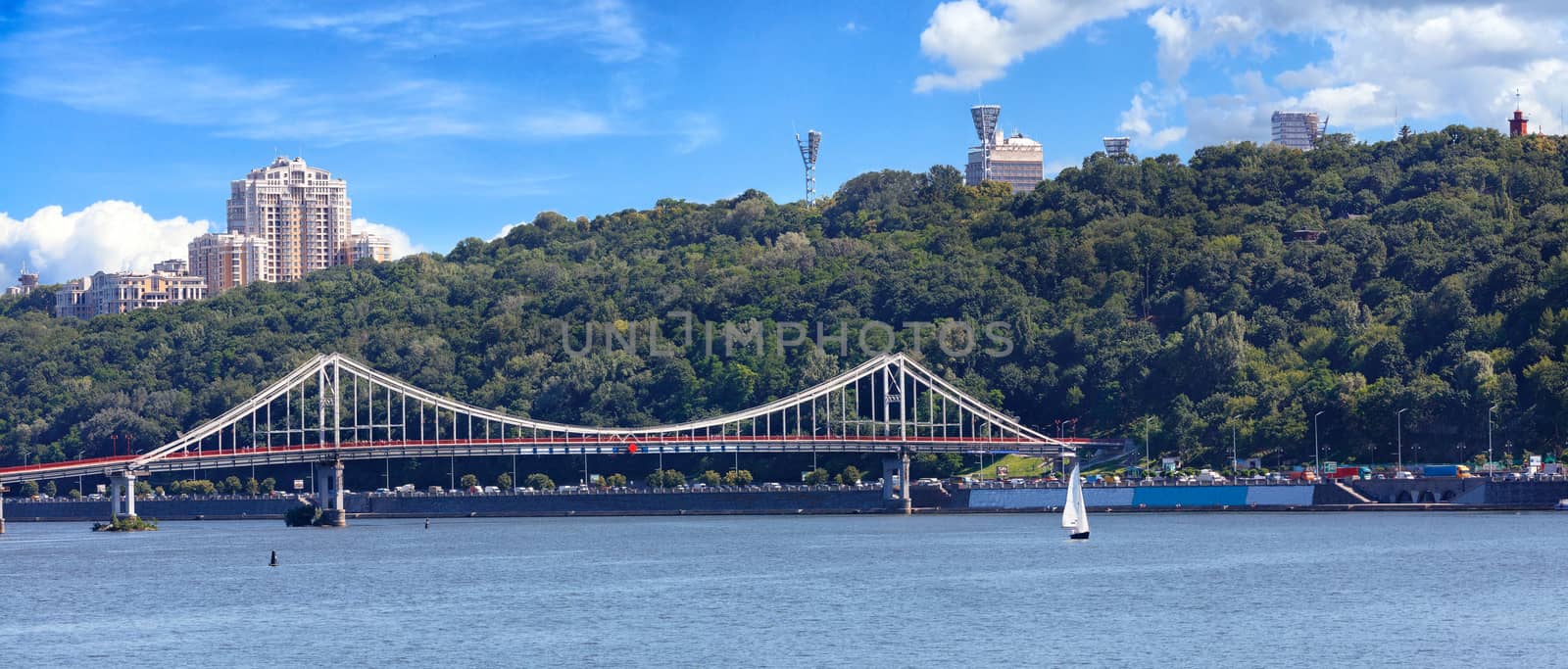 Panorama of the city of Kyiv, a view of the Dnipro River and a pedestrian bridge. by Sergii