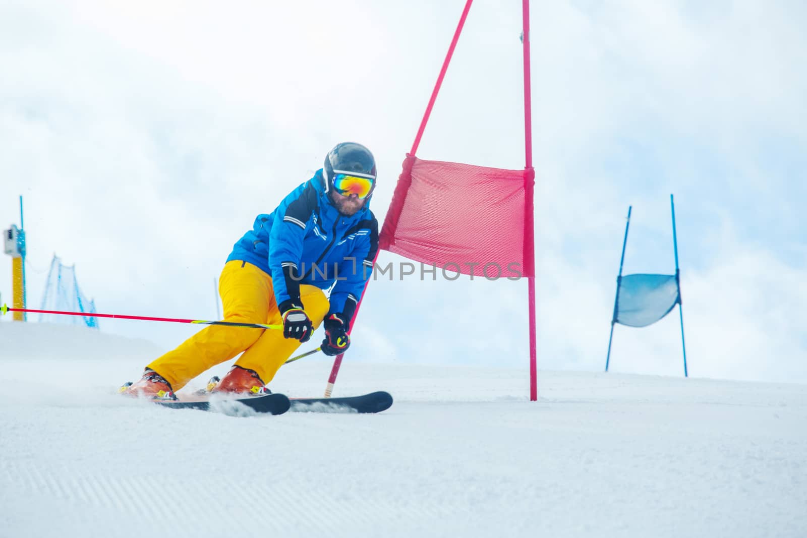 Gs Giant Slalom alpine ski racer skiing down the slope with gates sport winter training at Col Gallina Cortina d'Ampezzo Dolomites