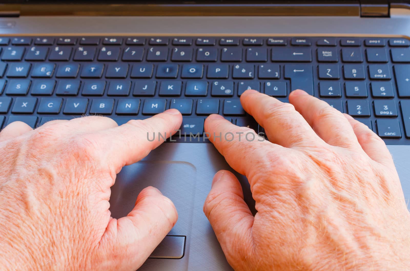 hands of a man working at the computer