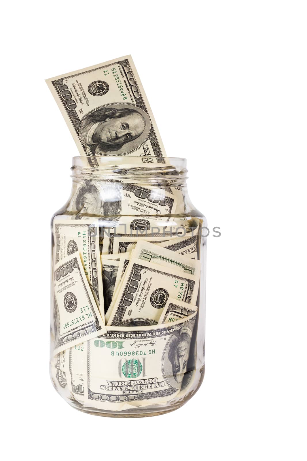 A hundred US dollars bank notes in a glass jar isolated on white background. Opened without cap.