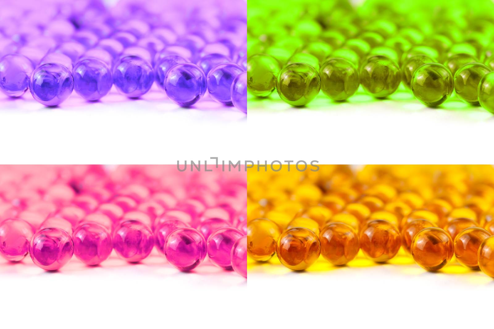 set of colored spherical ball capsules of fish oil selective focus isolated on white background.