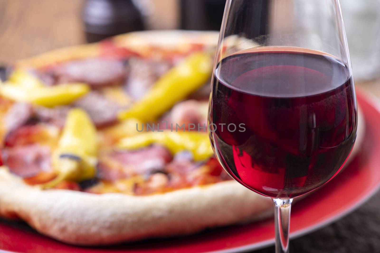 red wine and a fresh pizza