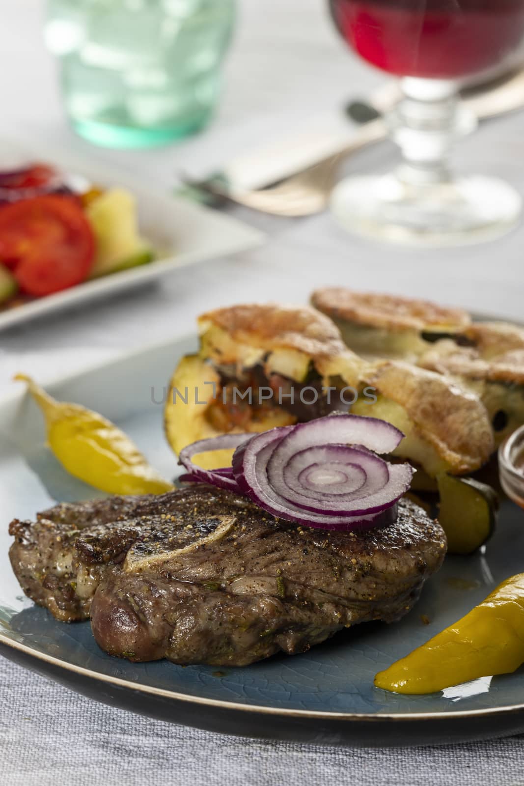 grilled lamb meat on a plate by bernjuer