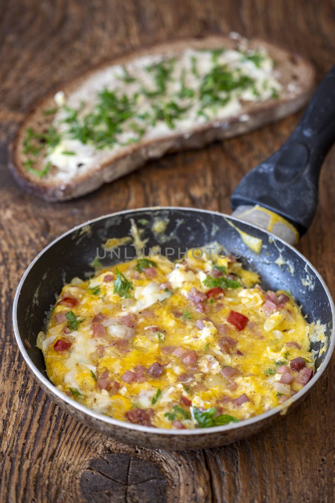scrambled eggs in a pan on wood