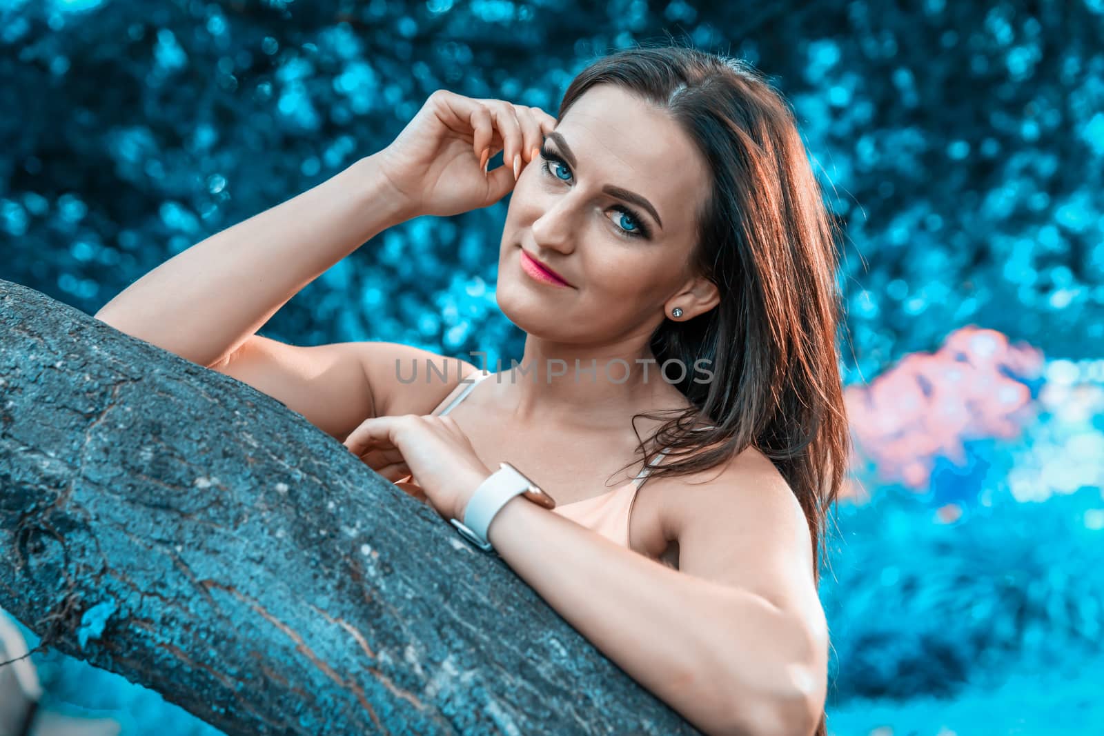 portrait of a beautiful young woman with blue surroundings by Edophoto
