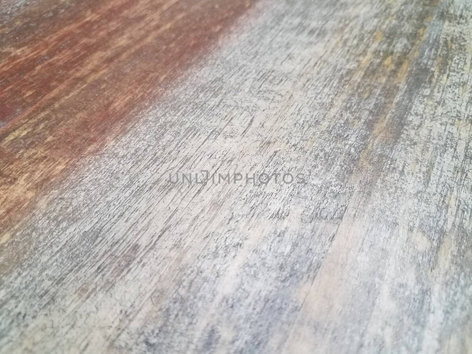 worn and faded brown and grey wood table or surface