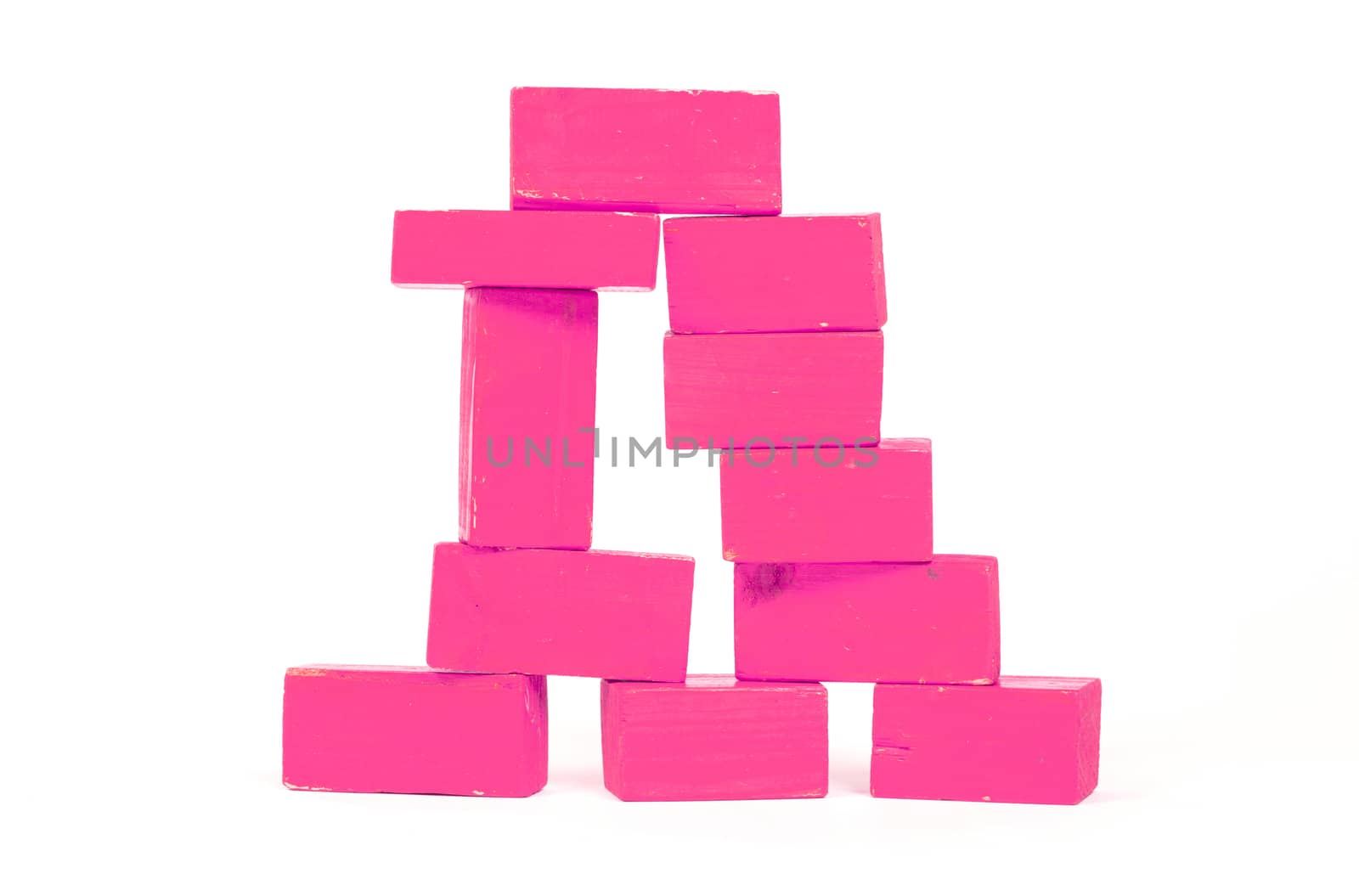 Vintage pink building blocks isolated on white background