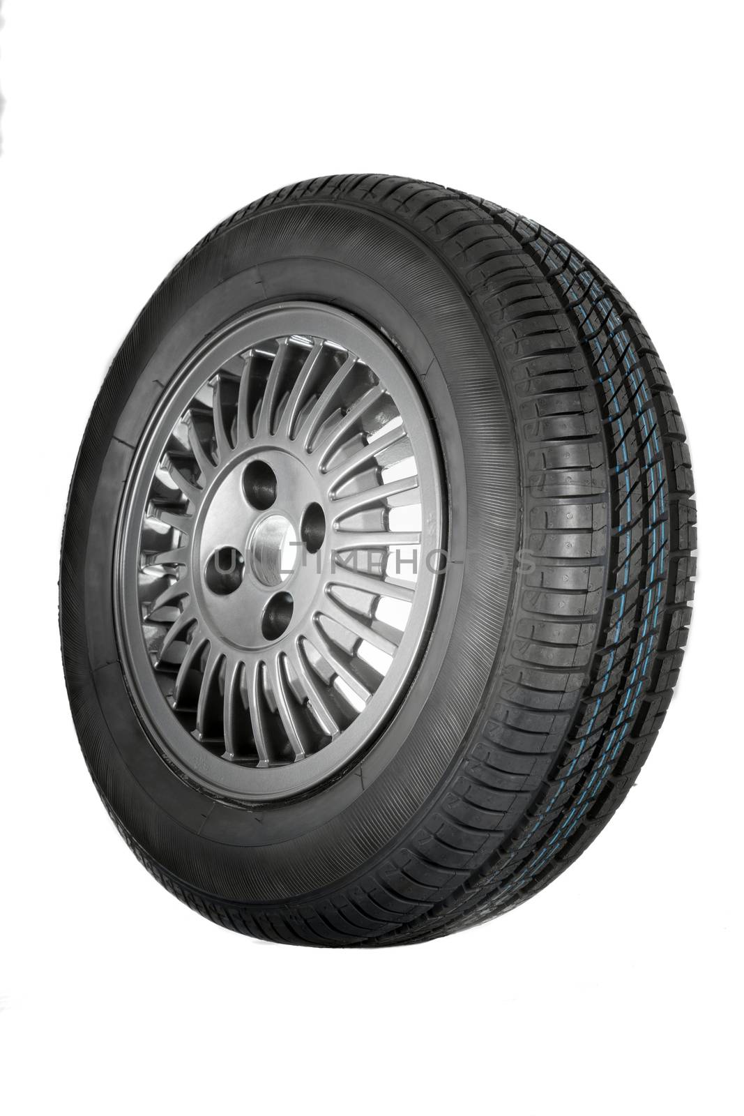 New and unused car tires against white isolated background