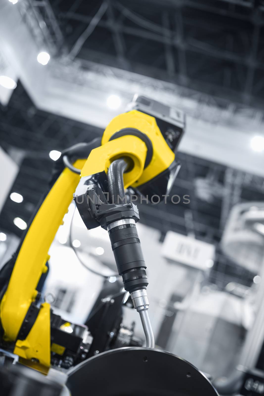 Automatic robot arm working in industrial environment close up