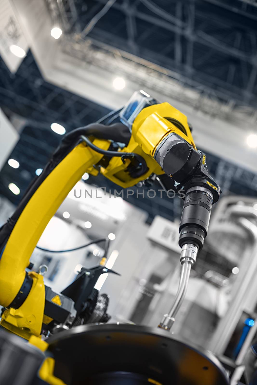 Automatic robot arm working in industrial environment close up