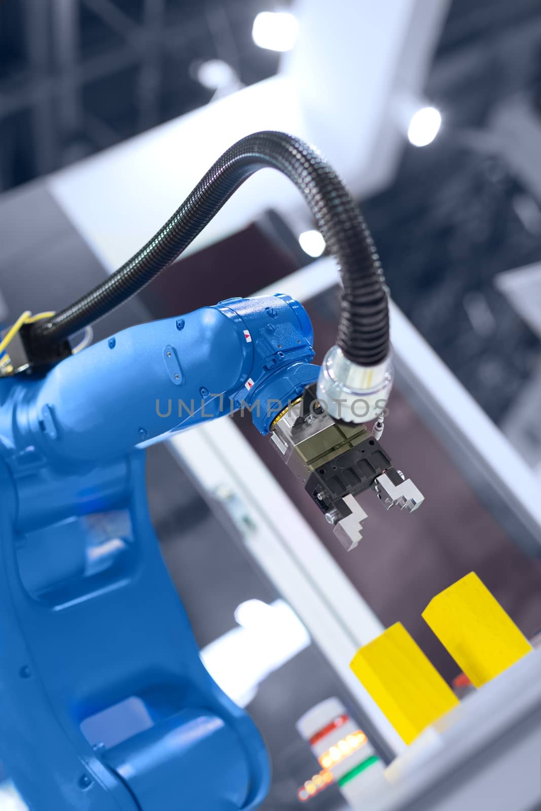 Automatic robot arm working in industrial environment close up