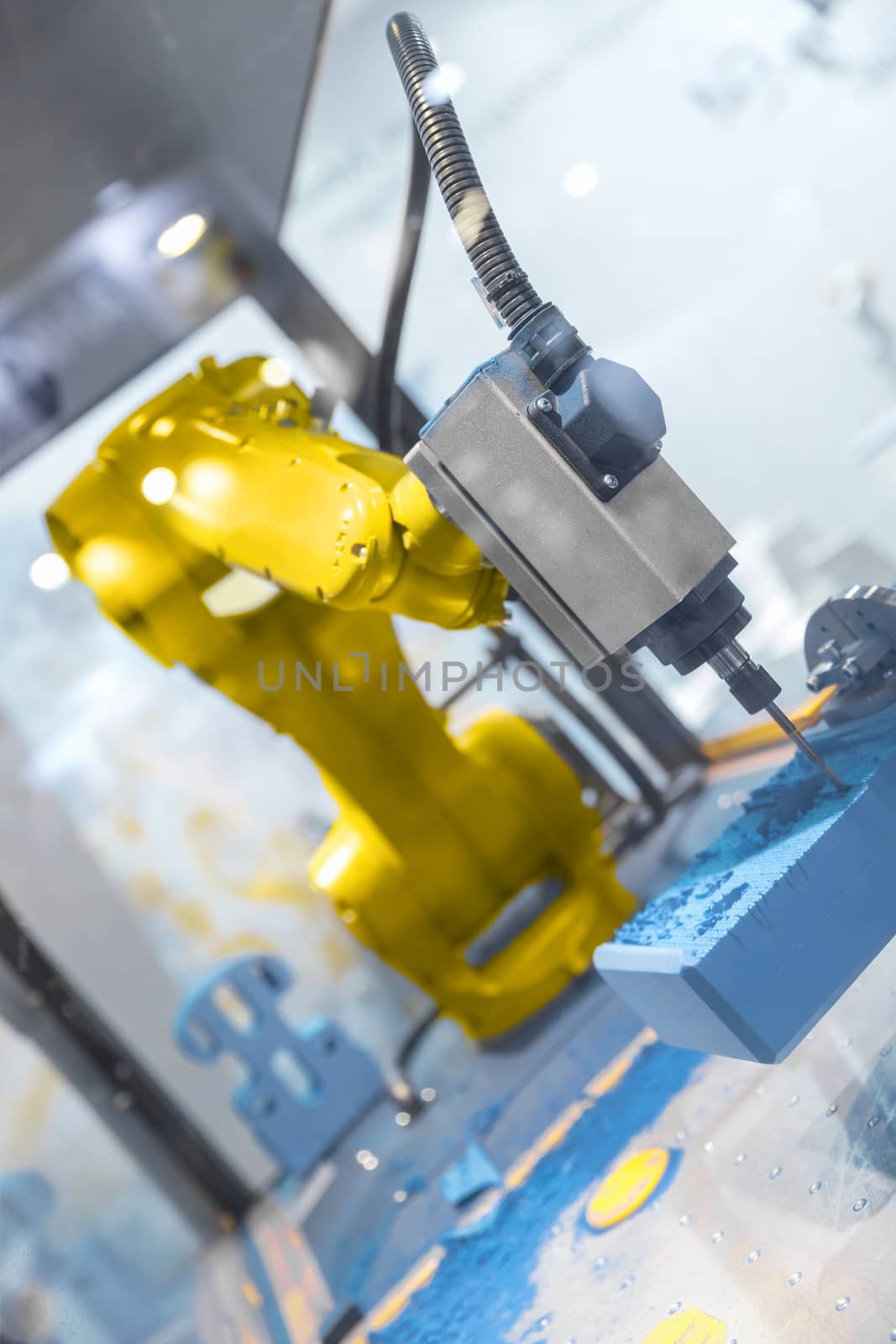 Automatic robot arm working in industrial environment close up