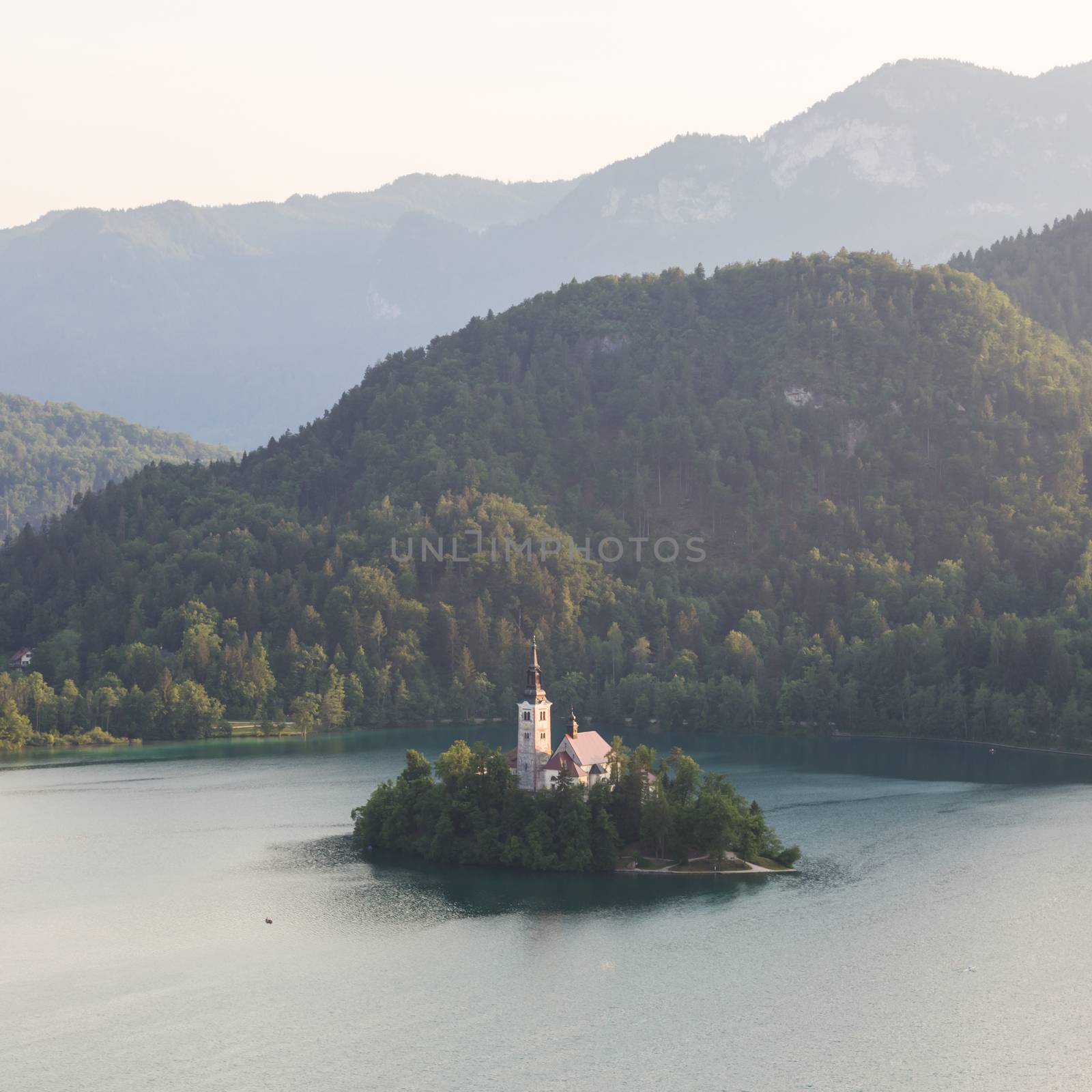 Lake Bled, island with a church and the alps in the background, Slovenia.