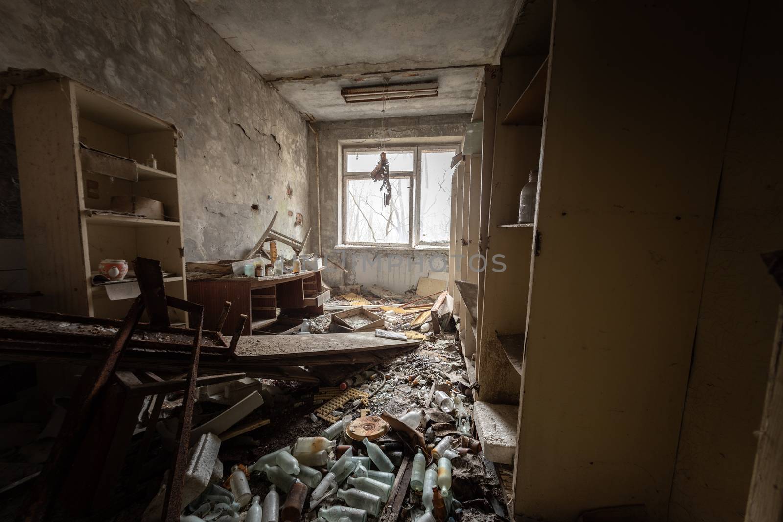 Abandoned and messy room in Pripyat post office angle shot