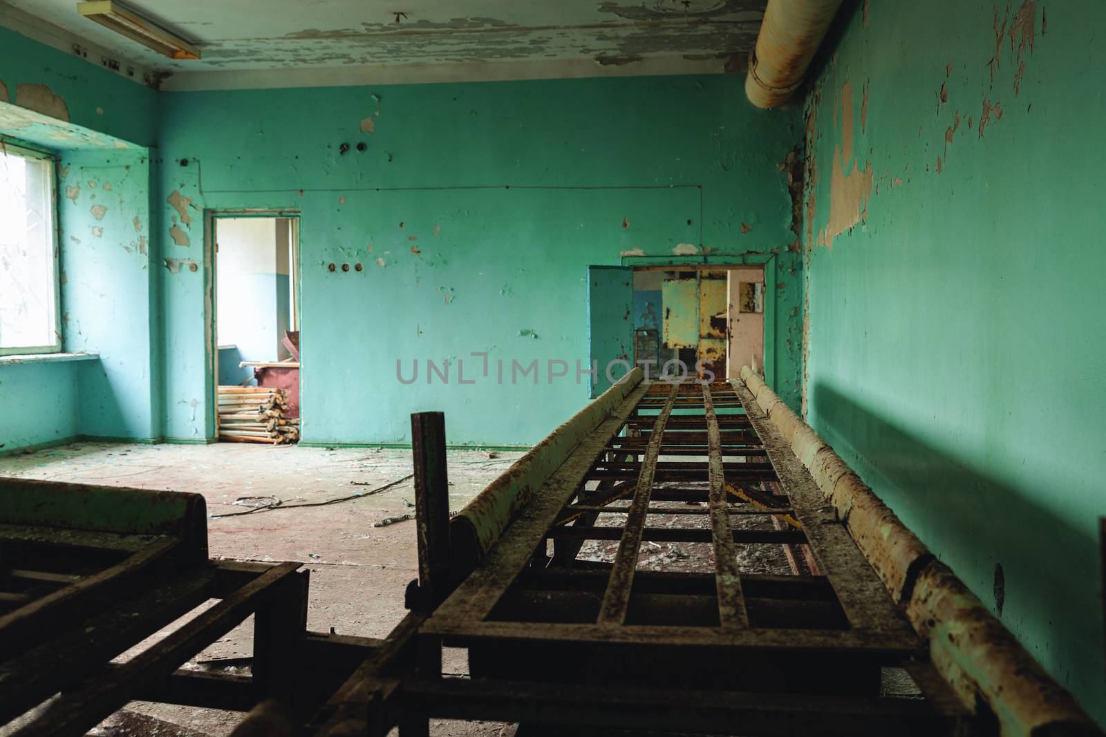 Abandoned and messy room in Pripyat post office angle shot