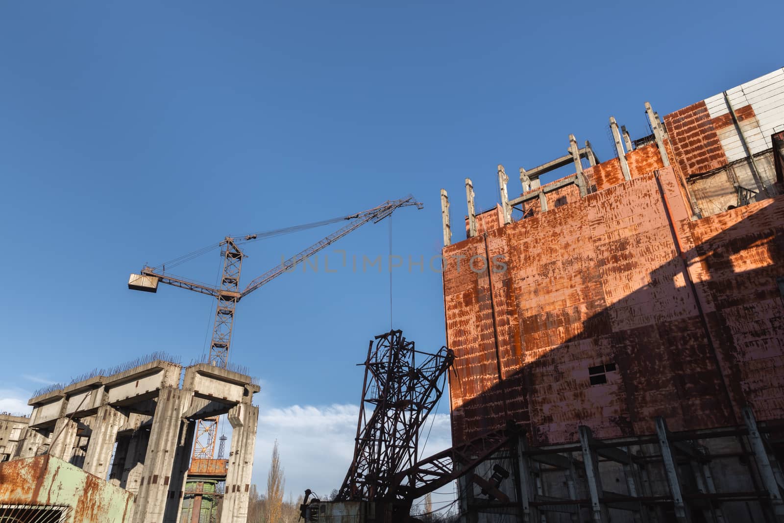 Abandoned construction site with industrial crane