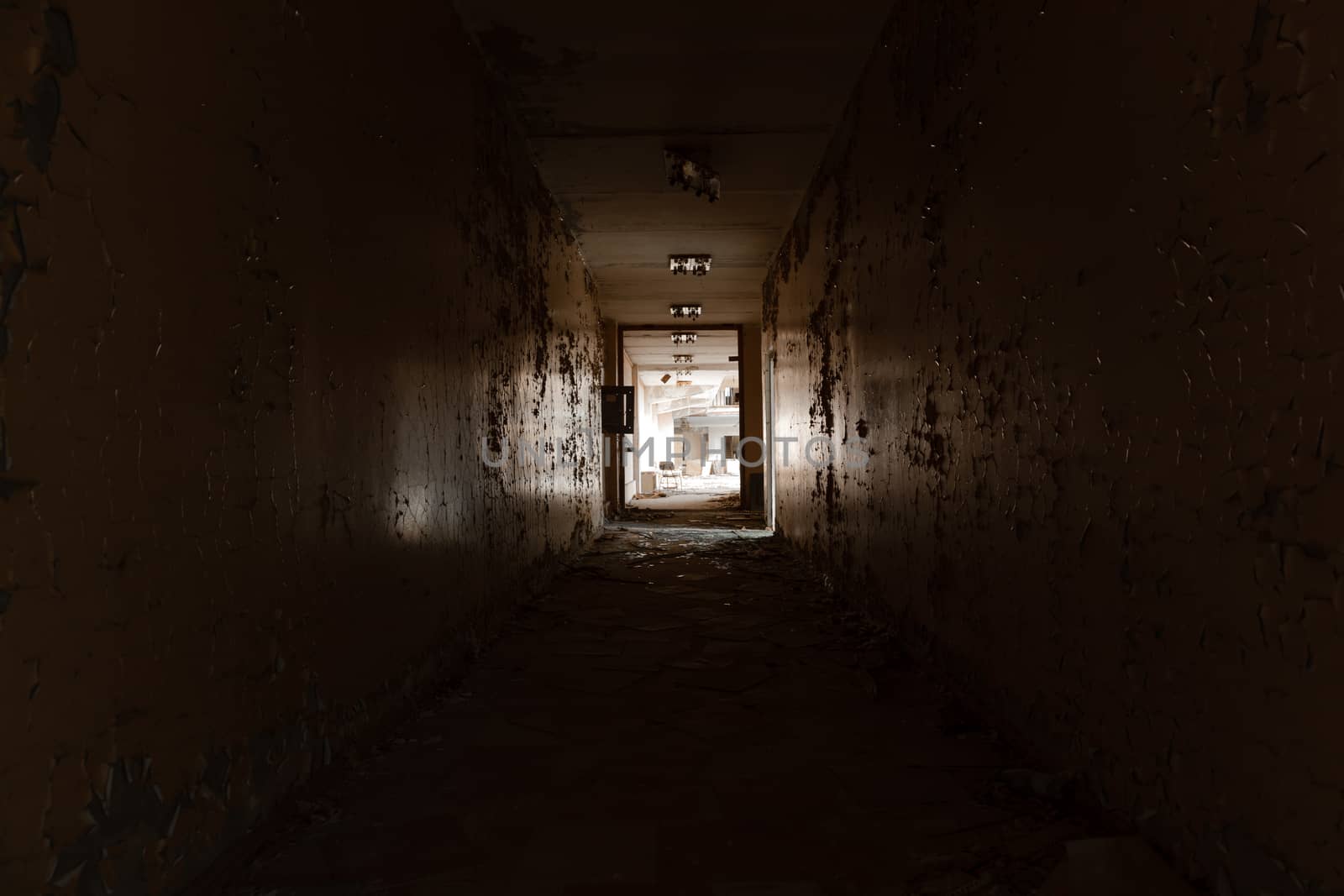 Abandoned hallway with light at the end by svedoliver