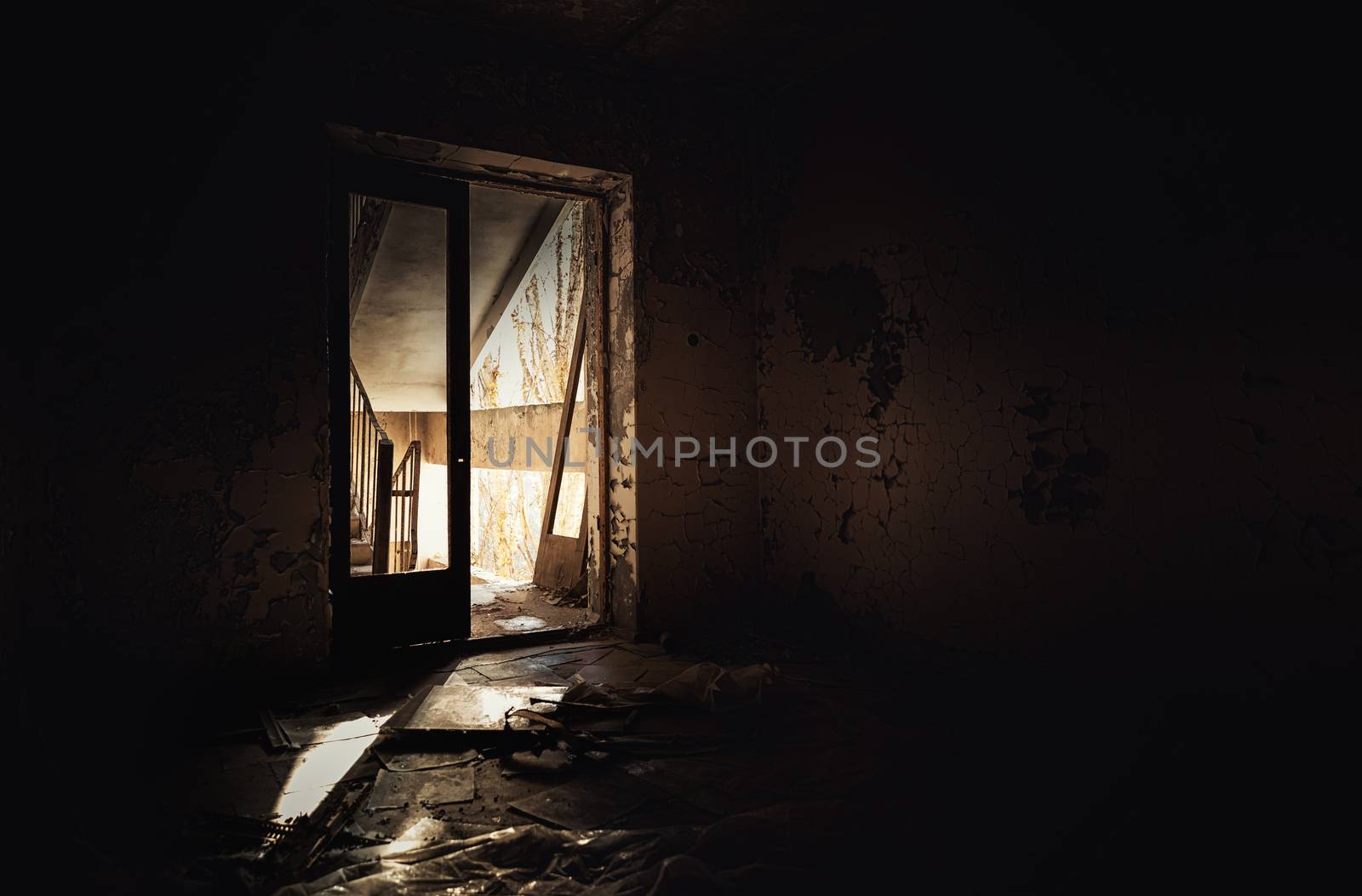 Abandoned hallway with light at the end shining