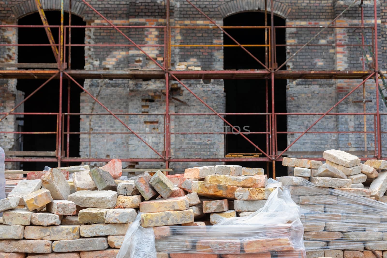 Closeup photo of construction site with bricks by svedoliver