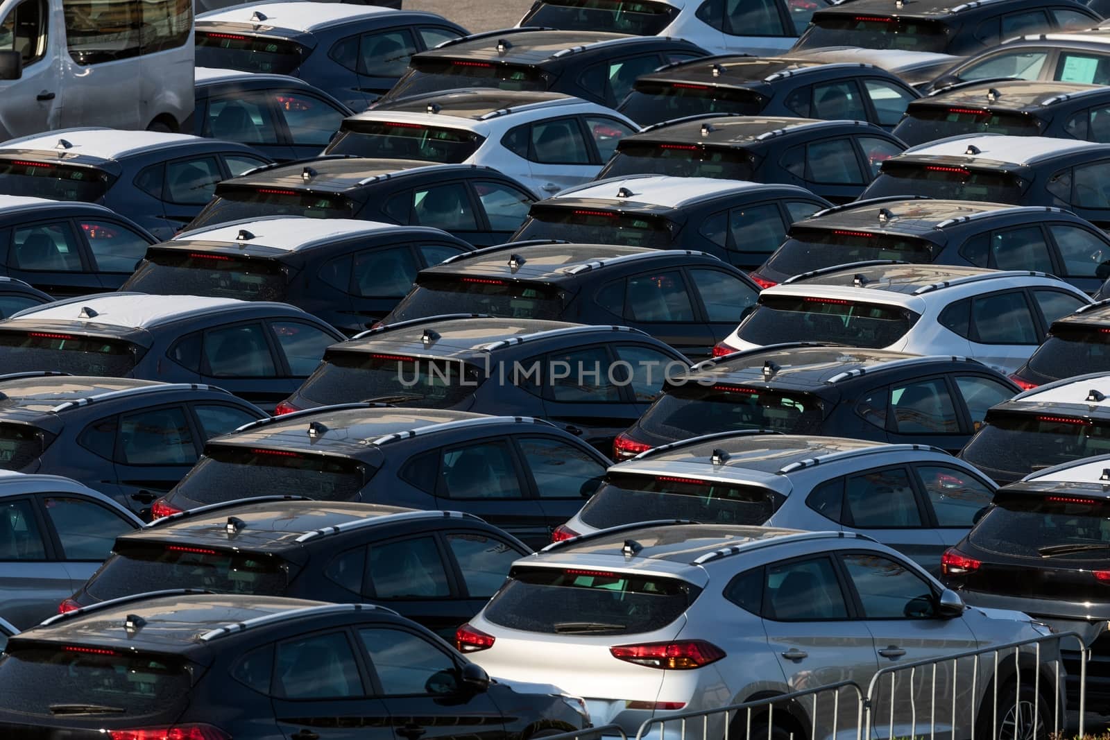 Lot of cars being transported to trade location closeup photo