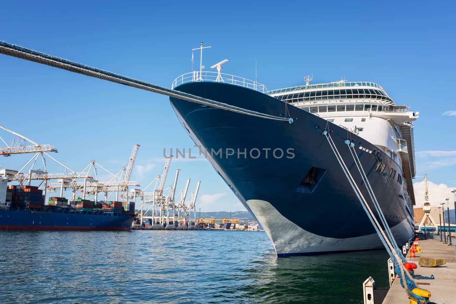 Large cruise ship anchored at the port closeup photo