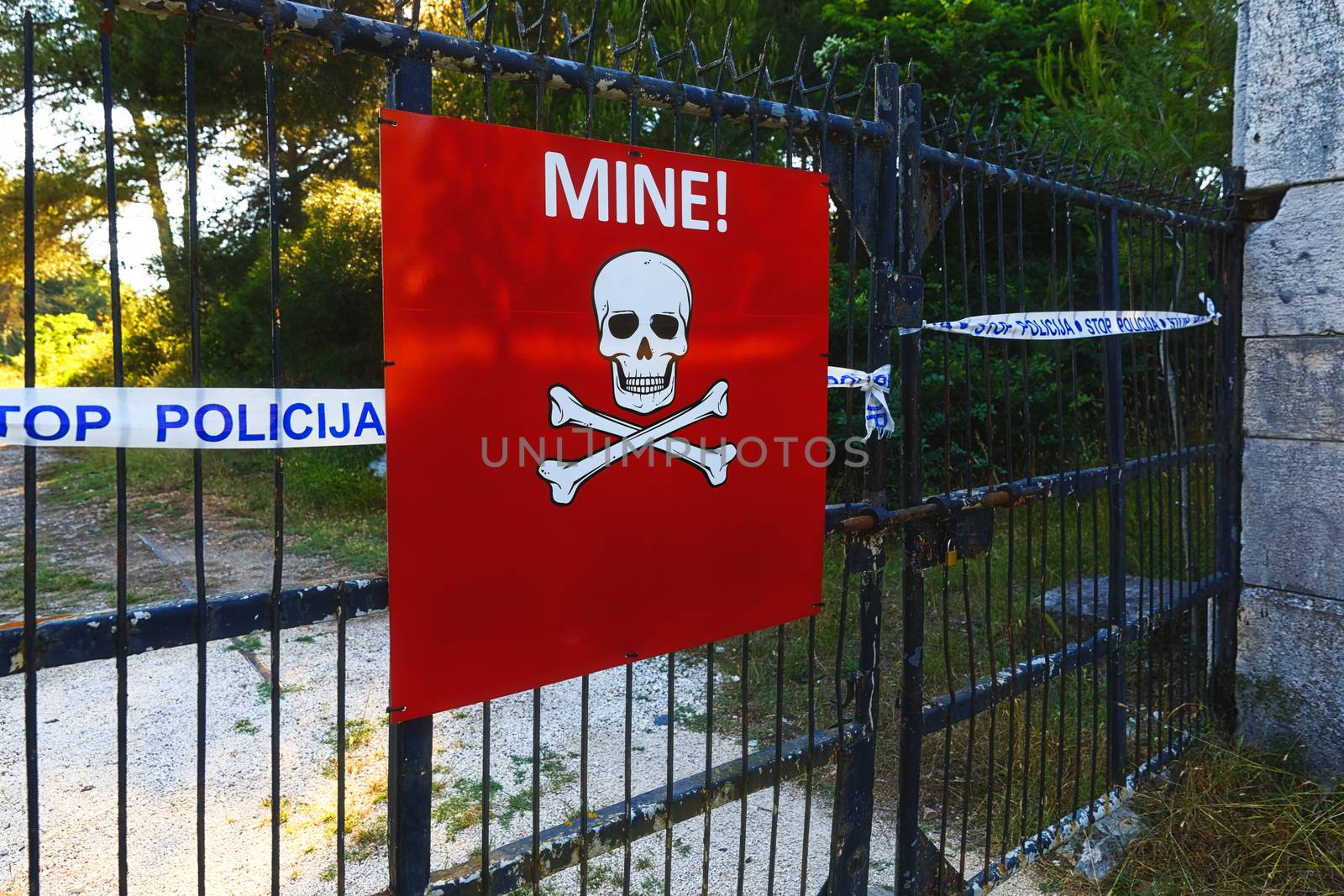 Beware of mines sign on closed territory closeup photo